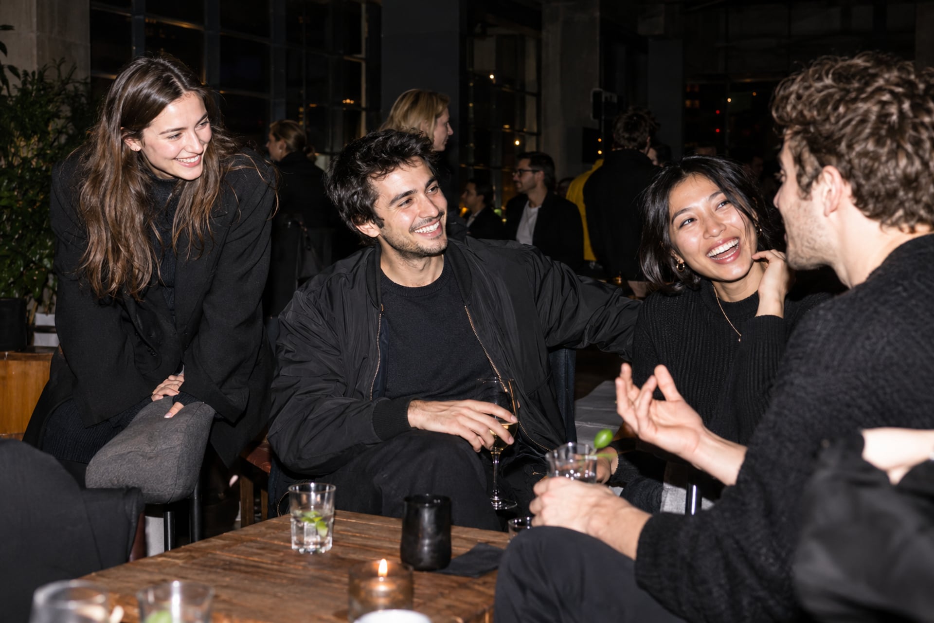 Members welcome a newcomer at a London loft meetup.